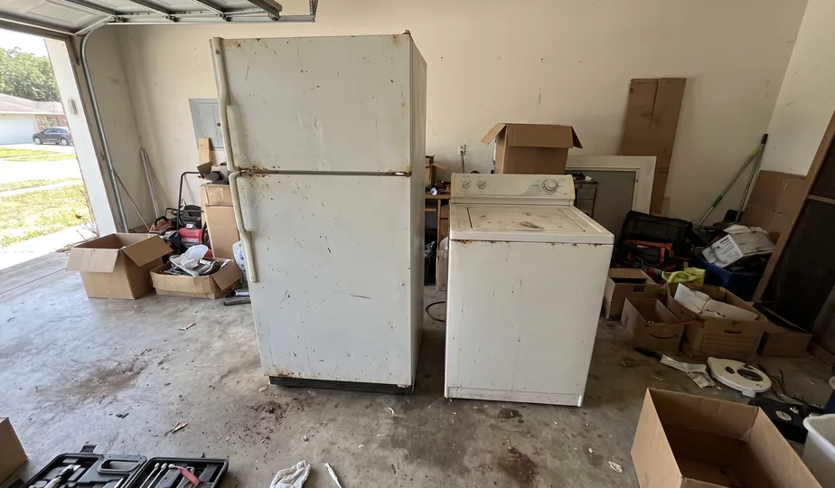 Old refrigerator and washing machine awaiting appliance removal in Portland, Oregon
